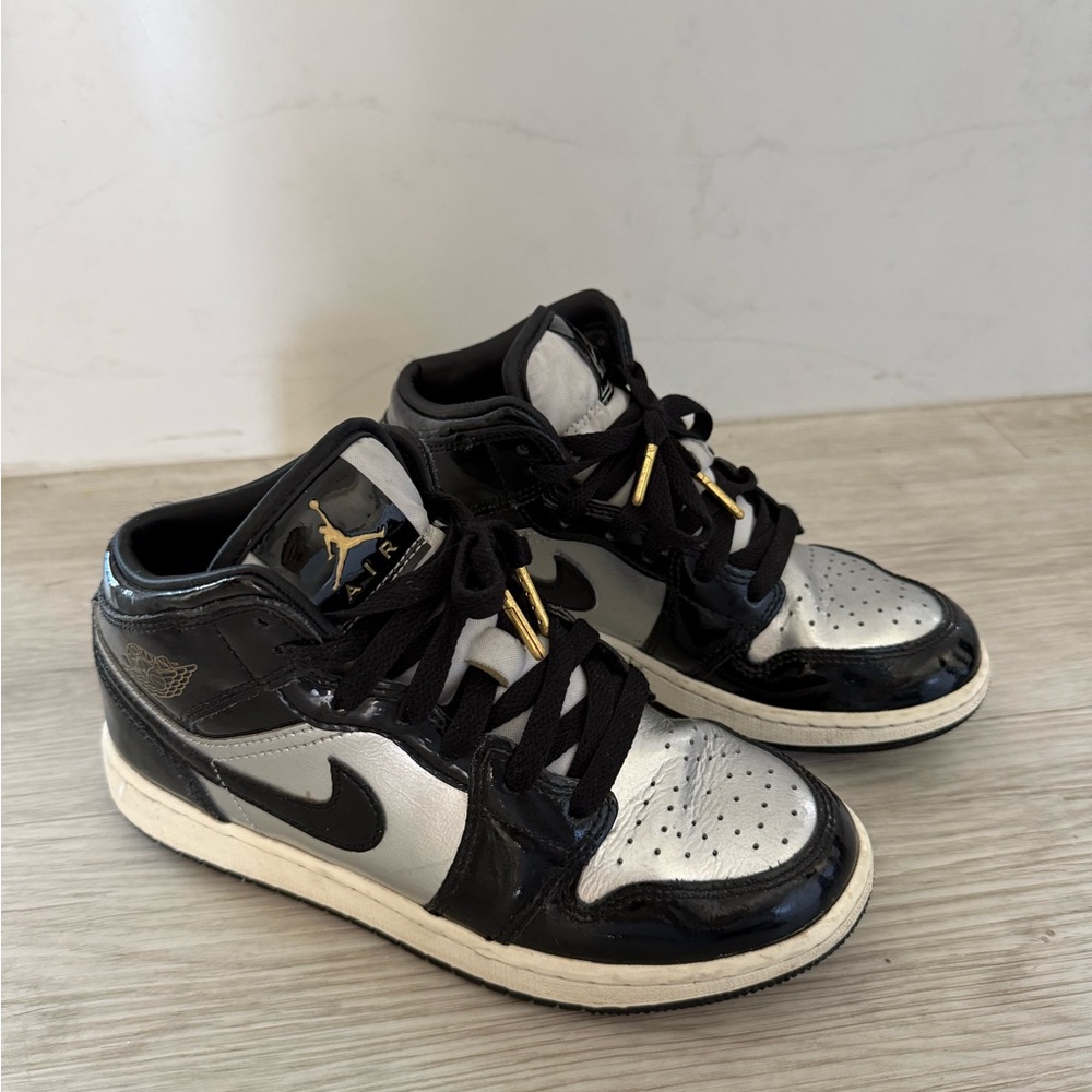 Nike Kids Black and Silver Sneakers with gold details. In great condition.